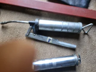 Grease gun for sale.
