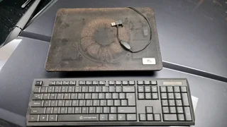 Laptop fan and wireless keyboard.