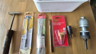 Lots of drill bits and woodwork tools.