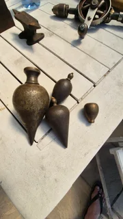 Vintage set brass from large to small plumb bobs.