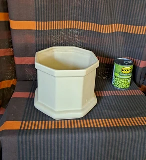 Ornamental pot plant holder.