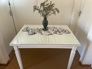 White dining table with glass top