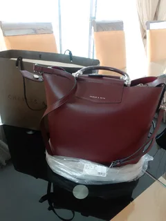 Ladies designer bag burgandy in colour  size XL Charles and Keith  brand