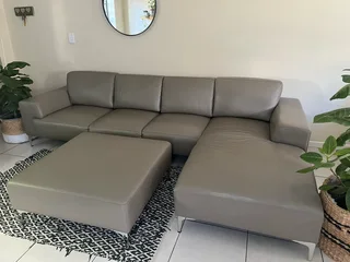 Beautiful Genuine leather L shape couch with leather ottoman included.