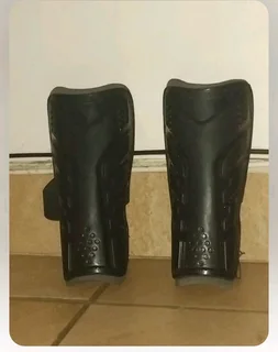 Hockey stick and shin pads