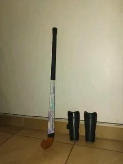 Hockey stick and shin pads