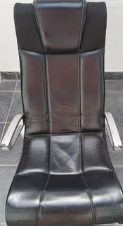 L Shape couch and a not genuine  leather rocking used arm chair