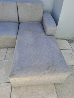 L Shape couch and a  leather rocking used arm chair .Picture was taken outside, don&#39;t hesitate .