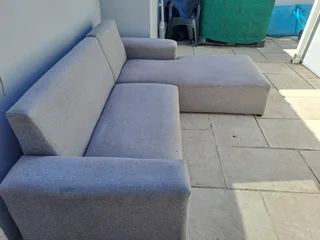L Shape couch and a  leather rocking used arm chair .Picture was taken outside, don&#39;t hesitate .