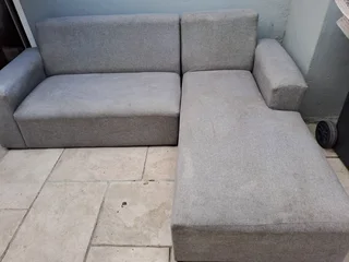 L SHAPE LOUNGE SUITE AND A BLACK ROCKING CHAIR