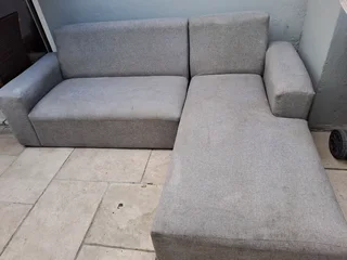 L Shape Lounge Suite And A Black Rocking Chair