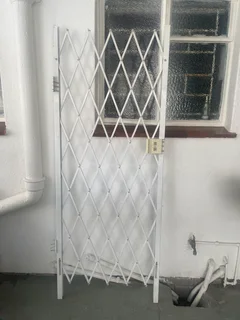 Garage roll up door and single safety gate