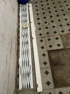 Garage roll up door and single safety gate