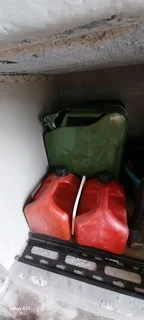 2x Steel Jerrycans and 2 x red 5lt petrol containers R150 each