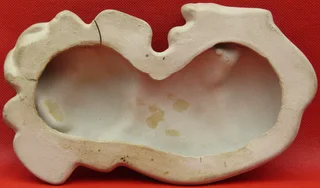 Clay Dog lying down - for your book shelf