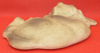 Clay Dog lying down - for your book shelf