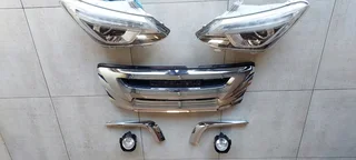 Isuzu front grill assymbly: Lights, fog lights, grill and chrome trim.