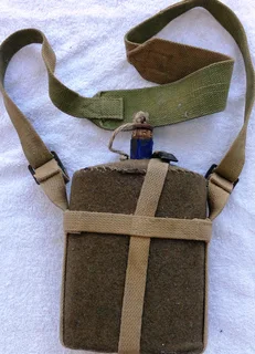 First World War British Army metal and cobalt blue enamel felt covered water bottle with khaki strap
