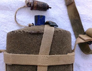 First World War British Army metal and cobalt blue enamel felt covered water bottle with khaki strap