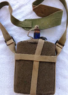 First World War British Army metal and cobalt blue enamel felt covered water bottle with khaki strap