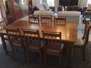 Kiaat wood Dining table and 8 chairs. As new