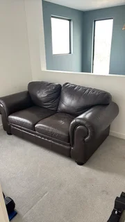 Dark brown genuine leather 2 seater couch.