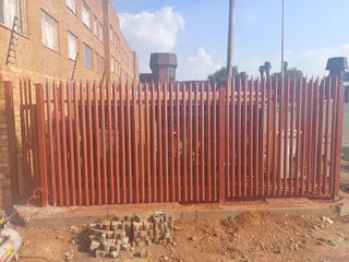 Palisade fencing, gates and paint