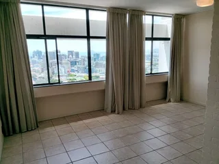 Secure Gardens Shopping Centre Studio Apartment. With endless views over the City and the Bay.