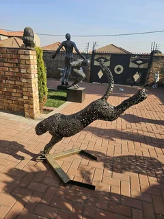 Metal Cheetah on the Run Sculpture