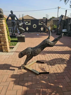 Metal Cheetah on the Run Sculpture