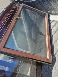 Meranti window frames, hinges and handles.