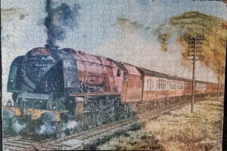 Mounted puzzles of railway scenes