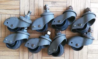 8 off Enclosed wheel swivel castors with M12 thread fixing