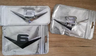 V8 and V6 metal badges emblems