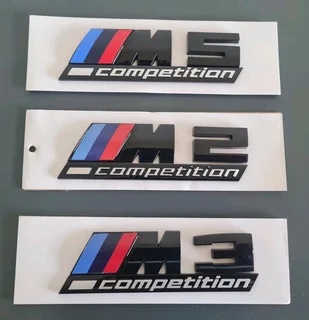 Black BMW Motorsport metal badges emblems.