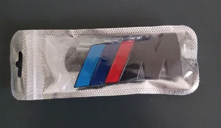 Black BMW Motorsport metal badges emblems.