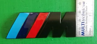 Black BMW Motorsport metal badges emblems.