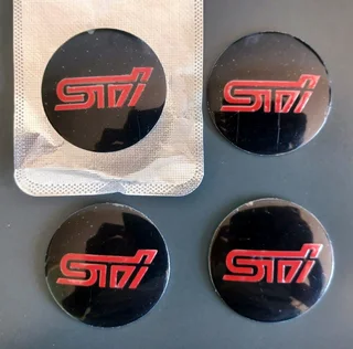 Subaru STI front metal chrome / red grille badge emblem