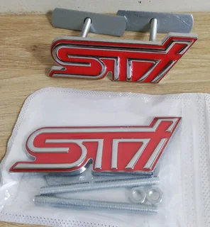Subaru STI front metal chrome / red grille badge emblem