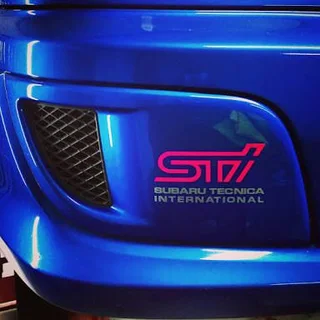 Subaru STI front metal chrome / red grille badge emblem