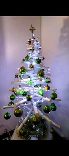 White wooden Christmas tree with decorations