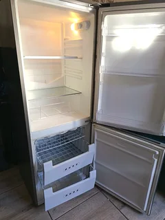 KIC Silver FRIDGE with freezer at the bottom. Just needs a new seal.