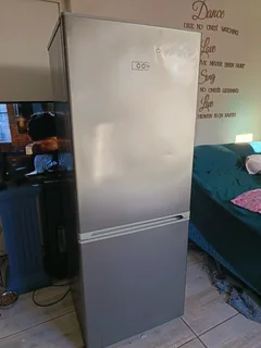 KIC Silver FRIDGE with freezer at the bottom. Just needs a new seal.