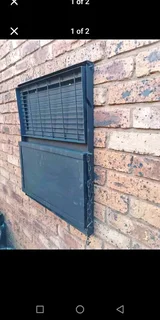 Wall mounted braai stand