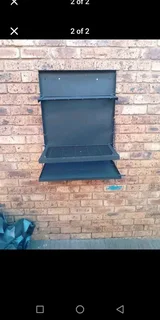 Wall mounted braai stand