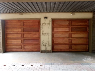 2 X New Garage Wooden single door single(10-piece sectional) with motors and all hardware