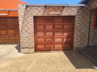 2 X New Garage Wooden single door single(10-piece sectional) with motors and all hardware