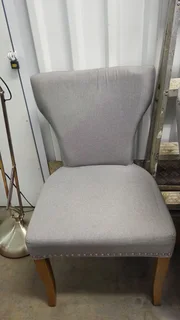 Round Glass Dining Table with Grey chairs