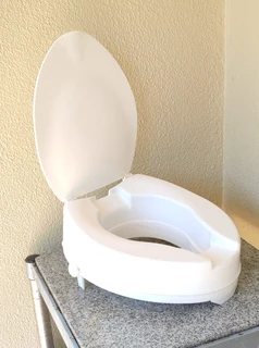 Raised toilet seat raiser with closing seat lid for sale
