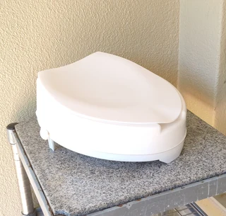 Raised toilet seat raiser with closing seat lid for sale